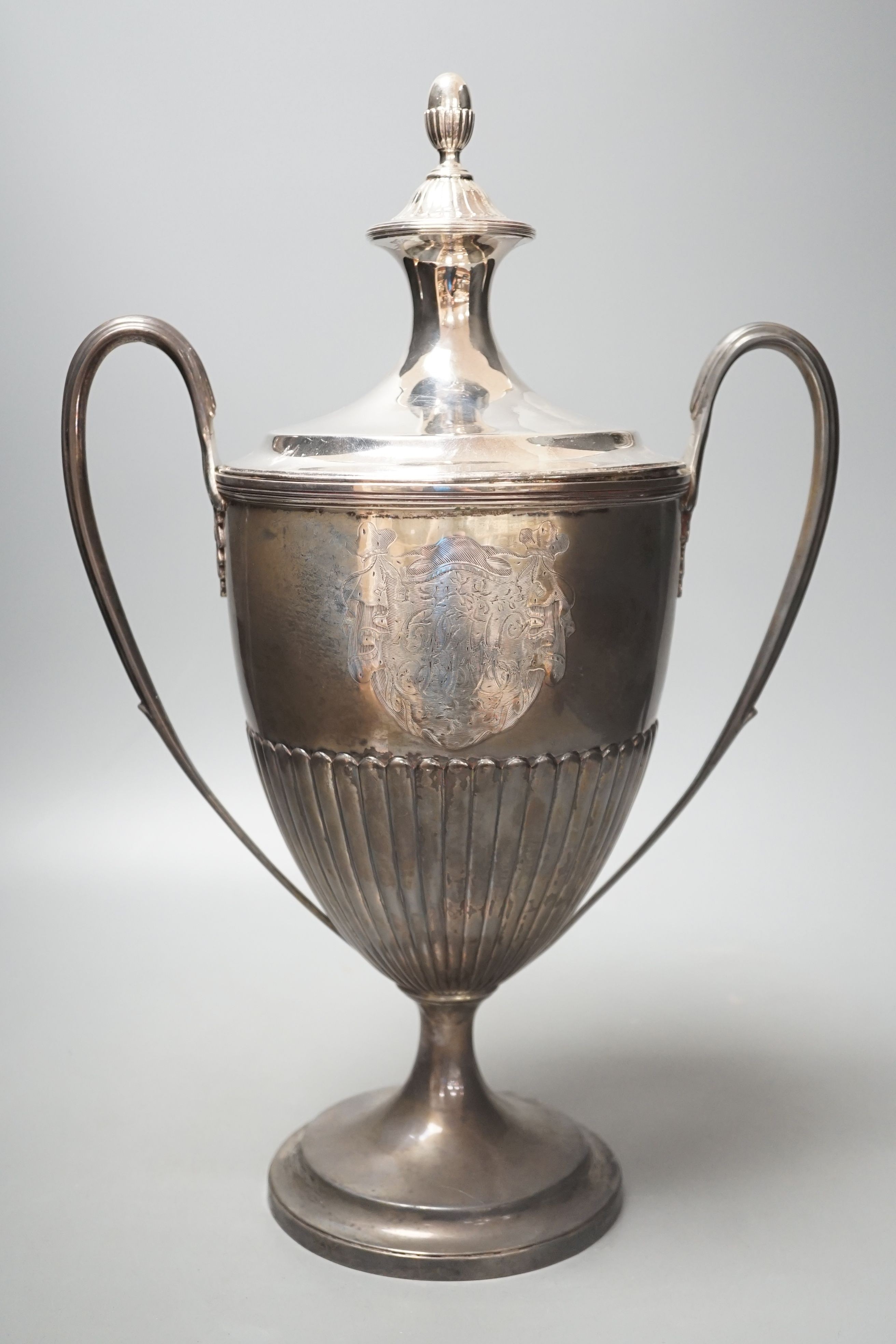 A George III demi fluted silver two handled urn shaped pedestal presentation trophy cup and cover, by William Fountain